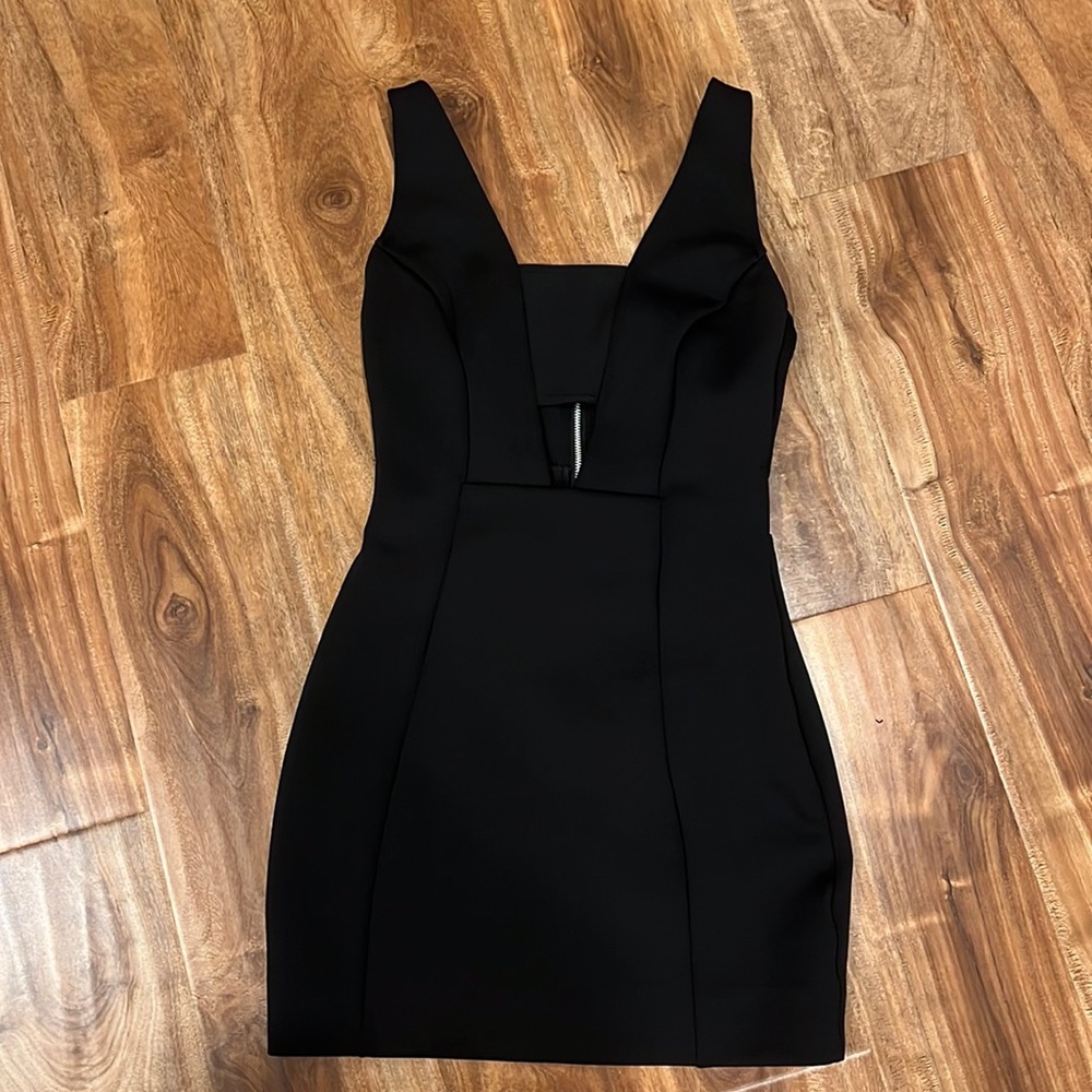 Black mini dress, cutouts in back